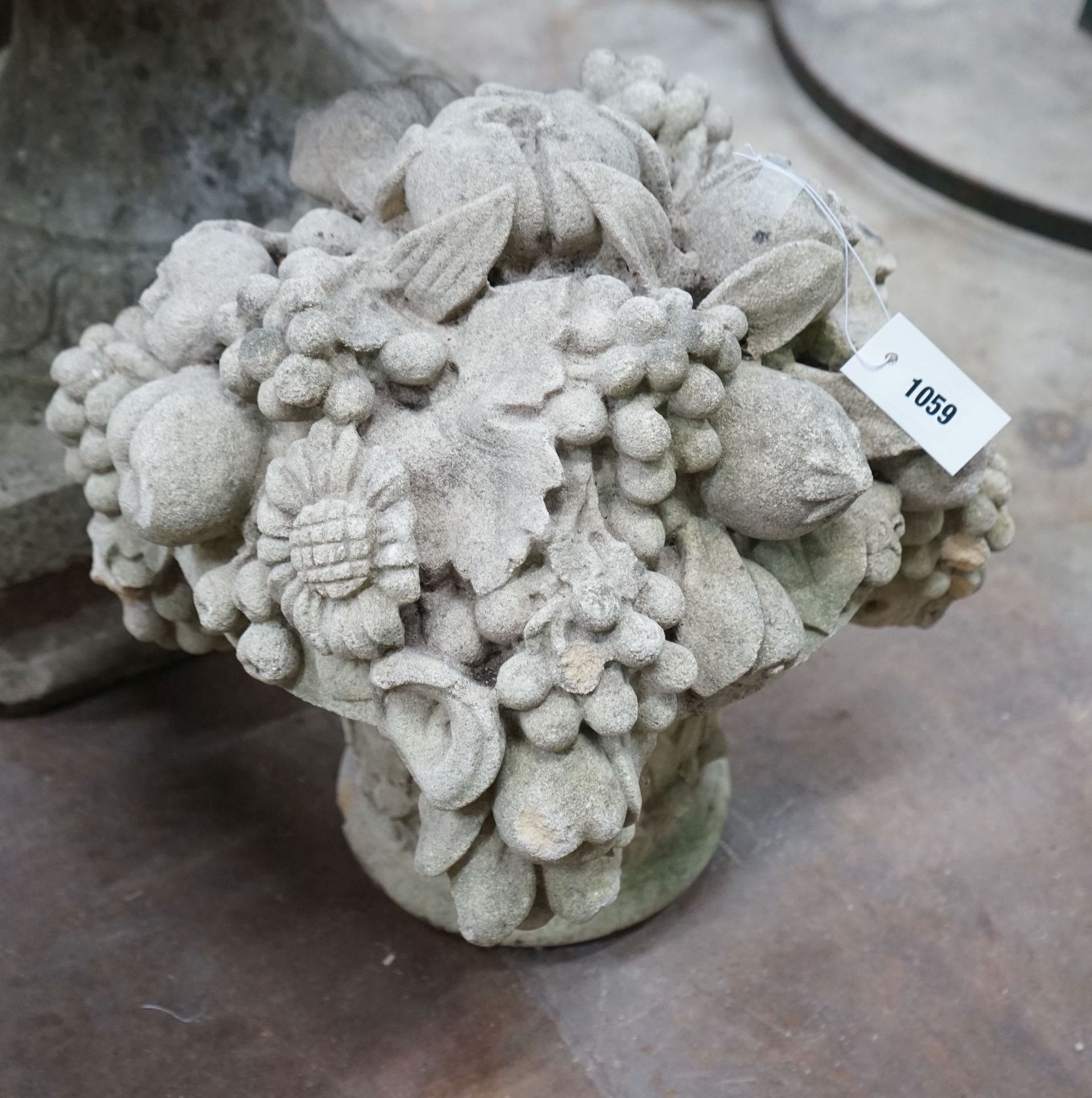 A pair of reconstituted stone flowering vase garden ornaments, height 48cm